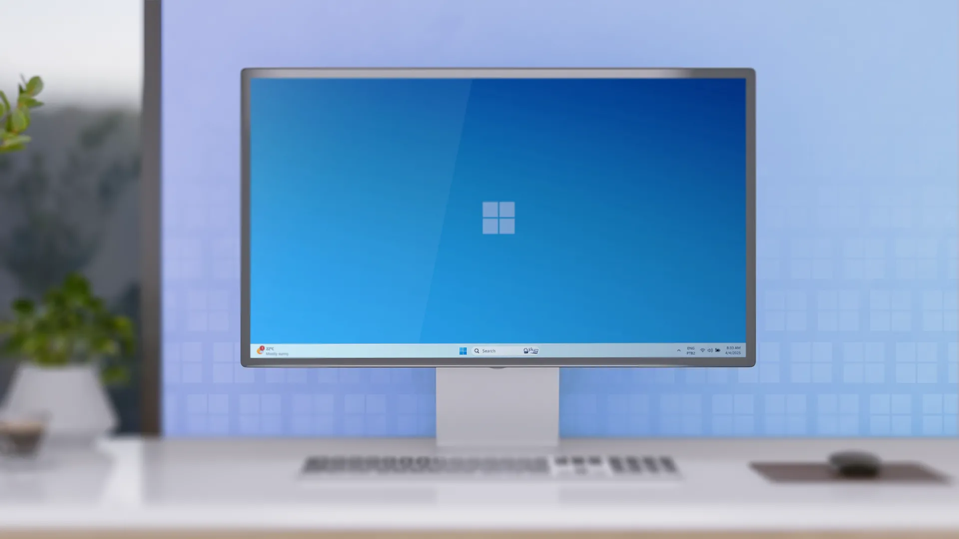 Bàn làm việc tối giản với một máy tính để bàn chạy Windows 11, đại diện cho hệ sinh thái PC truyền thống