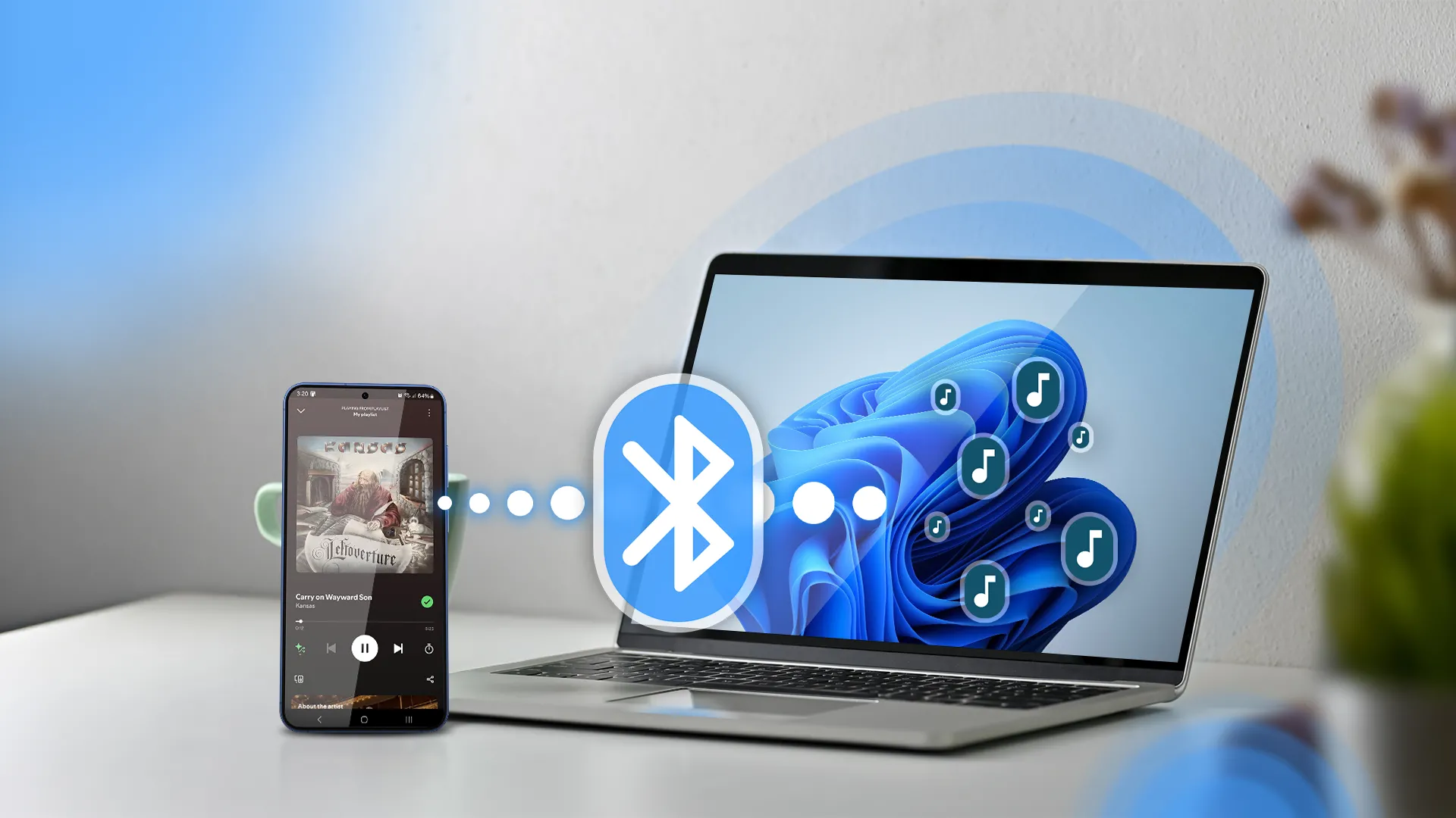 Điện thoại phát nhạc và laptop Windows 11 cạnh bên với biểu tượng Bluetooth, minh họa khả năng chia sẻ âm thanh đa thiết bị.