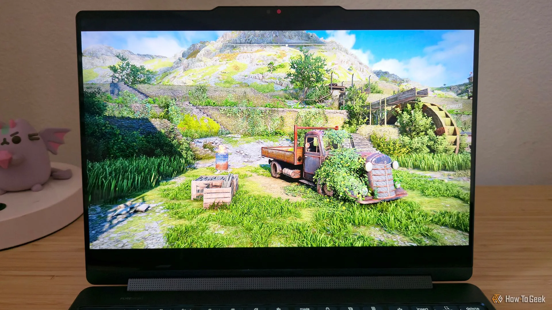 Laptop Lenovo Yoga 9i 2-in-1 Gen 10 chơi game Atomfall, minh họa khả năng giải trí nhẹ nhàng.