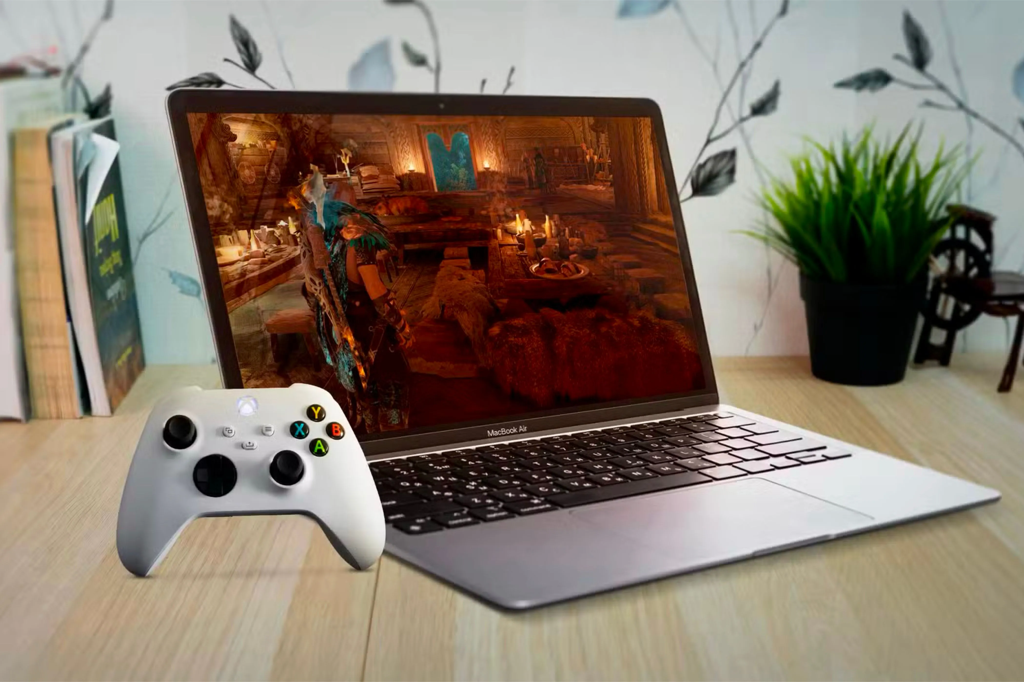 MacBook Air với bộ điều khiển Xbox đang chơi game, minh họa việc tối ưu hiệu suất gaming trên macOS.