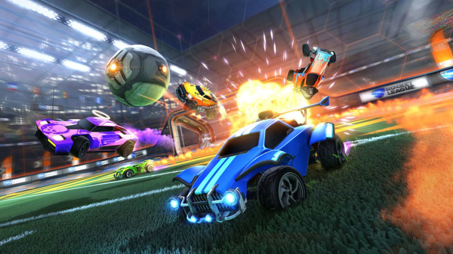 Một cảnh hỗn loạn trong Rocket League với những chiếc xe và quả bóng bay lượn trên không trung.