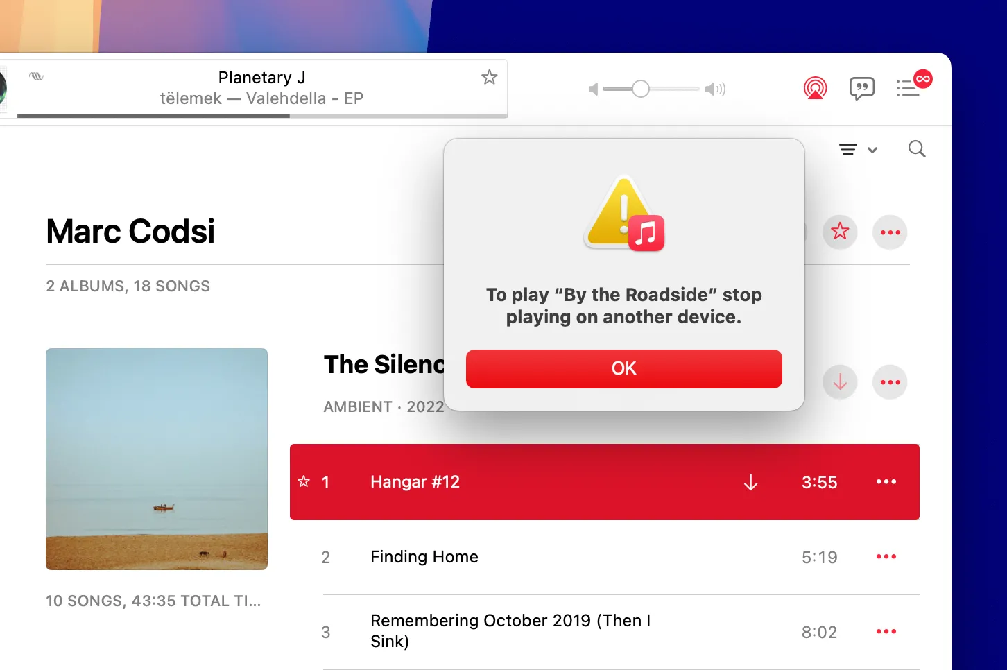 Hộp thoại lỗi &quot;Nhạc đang phát ở một thiết bị khác&quot; hiển thị trên ứng dụng Apple Music Mac