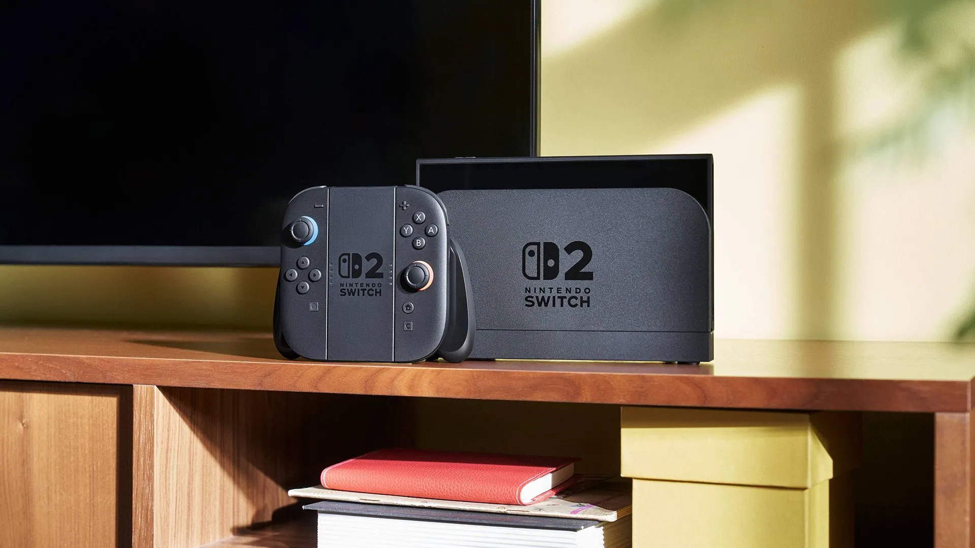 Nintendo Switch 2 cùng Joy-Cons khi gắn vào dock, sẵn sàng xuất hình ảnh 4K lên TV.