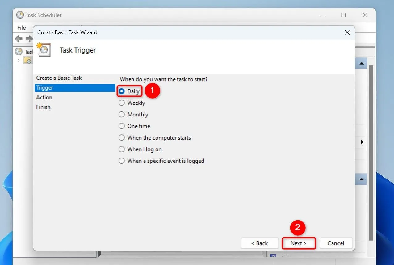 Cửa sổ &quot;Task Trigger&quot; trong Task Scheduler, chọn tần suất &quot;Daily&quot; để xóa file tạm thời hàng ngày.